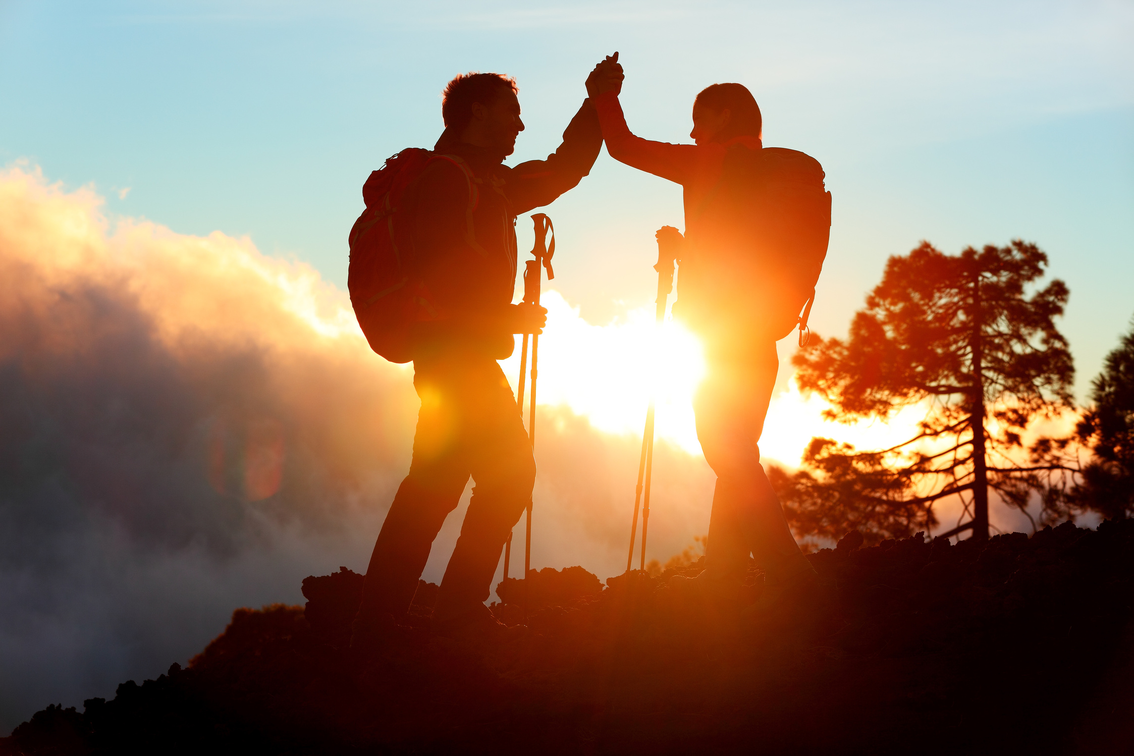 Hiking People Reaching Summit Top High Five
